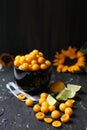 Yellow plums with lemon and lime on the black background. Ingredients for a jam. Food photography. Vertical image Royalty Free Stock Photo