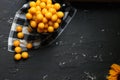 Yellow plums with sunflower on the black background. Ingredients for a jam. Food photography. Yellow sunflower, Royalty Free Stock Photo