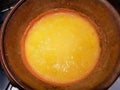Yellow polenta cooked in copper cauldron. Typical food of northern Italy
