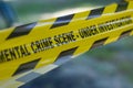 Yellow police line tape.Crime scene with blurred light background.