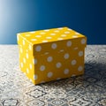 Yellow Polka Dot Box on Patterned Floor Royalty Free Stock Photo