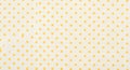 Yellow polka dot pattern on a textured white fabric background Royalty Free Stock Photo