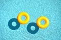 Yellow pool float, pool ring in cool blue refreshing blue pool