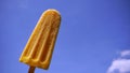 yellow popcicle blue sky Royalty Free Stock Photo