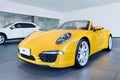 Yellow Porsche cabriolet in a showroom, Wenzhou, China