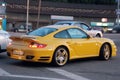 Yellow Porsche on the streets of Moscow evening