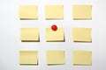 Yellow post it note and magnet button on whiteboard Royalty Free Stock Photo