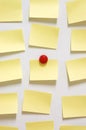 Yellow post it note and magnet button on whiteboard Royalty Free Stock Photo