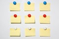 Yellow post it note and magnet button on whiteboard Royalty Free Stock Photo