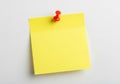 Yellow post-it note with red pushpin Royalty Free Stock Photo