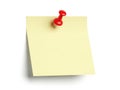 Yellow post-it note with red pushpin isolated on white background Royalty Free Stock Photo