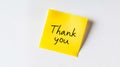A yellow post it note with the words thank you written on it Royalty Free Stock Photo
