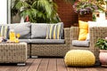 Yellow pouf on wooden terrace Royalty Free Stock Photo