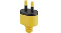 Yellow power adapter plug with two flat prongs and a grounding pin Royalty Free Stock Photo