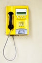 Yellow public telephone Royalty Free Stock Photo