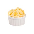 Yellow puff corn sticks ring in white ceramics bowl isolated on white background. Royalty Free Stock Photo