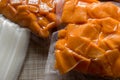 yellow pumpkin cut into slices and cubes and vacuum packed Royalty Free Stock Photo