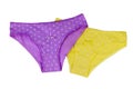 Yellow and purple cotton women`s briefs isolated on white background