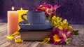 Yellow and purple flowers of alstroemeria, blue cup of coffee. Romantic composition with candles and a book.