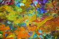 Yellow purple blue gold paint blurred splashes, colorful vivid waxy colors, contrasts creative background