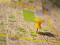 Yellow pushpin on a map Royalty Free Stock Photo