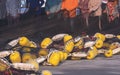 yellow pvc fishing buoys float of otter trawl with blurred background of fishermen group are repairing broken nets