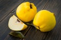 Yellow quince or queen apple autumn fruits with leaves Royalty Free Stock Photo