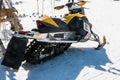 Yellow Racing Snowmobile in winter day