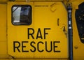 Yellow RAF Royal Air Force rescue military Sea King helicopter writing text on sliding metal aircraft door