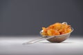 Yellow raisins on an aluminum sieve