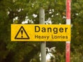 Yellow rectangle road sign on pole danger heavy lorries Royalty Free Stock Photo