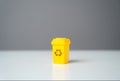 Yellow recycling bin. Circular economy.