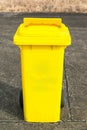 Yellow recycling bin