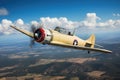 yellow and red airplane plane in flight. vintage, retro, single engine prop aircraft from the WWII era. vast horizon. Royalty Free Stock Photo