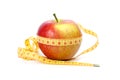 Yellow-red apple and measurement tape