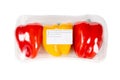 Yellow and red bell pepper packed and labeled on white background