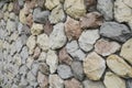 Yellow, red, blue, stones and pebbles on gray wall, background Royalty Free Stock Photo