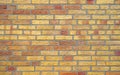 Yellow asnd red brick wall background Royalty Free Stock Photo