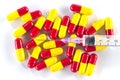 Yellow with red capsules and syringe, medication cure