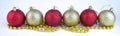 Yellow and red Christmas balls in a row long banner. Royalty Free Stock Photo