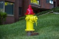 Yellow and red fire hydrant downtown Royalty Free Stock Photo