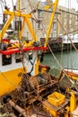 Yellow and Red Fishing Boat Moored in Polperro Harbour, Cornwall Royalty Free Stock Photo