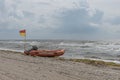 Yellow and red flag meaning that the beach has lifeguard supervision Royalty Free Stock Photo