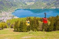 Gondolas of Zwoelferhorn Seilbahn cable way and a view of alpine town St.Gilgen and Wolfgangsee lake Royalty Free Stock Photo