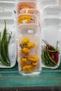 Yellow, red, and green peppers wrapped in cellophane plastic at the Municipal Market in Atlanta Georgia Royalty Free Stock Photo