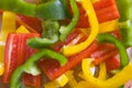 Yellow, red and green sliced peppers.