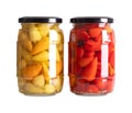 Yellow and red hot baby peppers, small hot chilis, pickled in glass jars Royalty Free Stock Photo