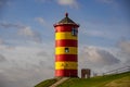 The yellow-red lighthouse of Pilsum in the morning sun Royalty Free Stock Photo