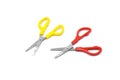 Yellow and red plastic scissors isolated on white. Royalty Free Stock Photo