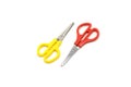 Yellow and red plastic scissors isolated on white. Royalty Free Stock Photo